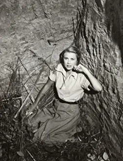 Grace Kelly Cowering in Cave
