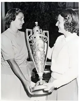 Title Prints: Grace Lenczyk and Helen Sigel Holding Trophy