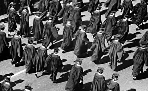 Graduation Prints: Graduates walking in rows outdoors