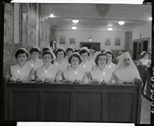 Graduating Nurses Kneeling in Chapel