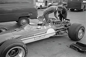 Driver Prints: Graham Hill Inspects Car