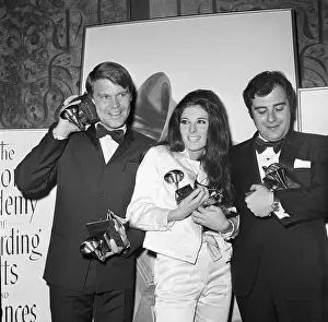 Grammy Award Winners Holding Statuettes