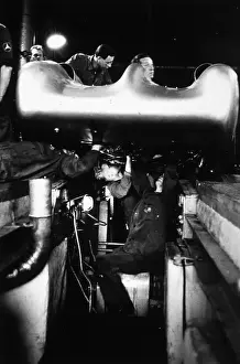Prints of Workmen get into some awkward places to make their repairs on a Mercedes Benz in a pit at the French Grand Prix in Reims Vintage Car Collection Prints: Grand Prix Mechanics