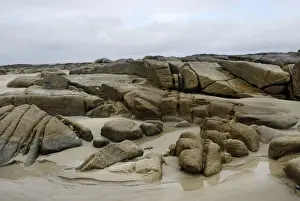 Polish Prints: Granite rocks in tidal zone of sandy beach at the Altanic coast of Donegal on a foggy day