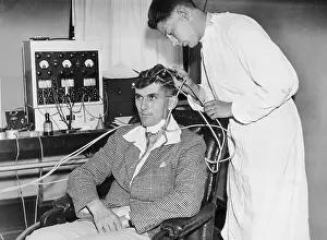 Gray Walter Using Device to Measure Brain Waves
