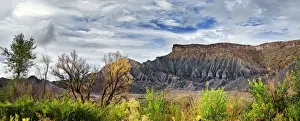 Mountain Chain Prints: Green fertile valley with the South Caineville Mesa after a thunderstorm