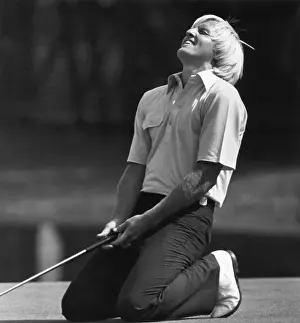 Greg Norman Kneeling
