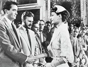 Prints of (Original Caption). Gregory Peck, Eddie Albert and Audrey Hepburn in a scene from the movie: Roman Holiday Timeless Moments: Gregory Peck, Audrey Hepburn and Eddie Albert in Roman Holiday