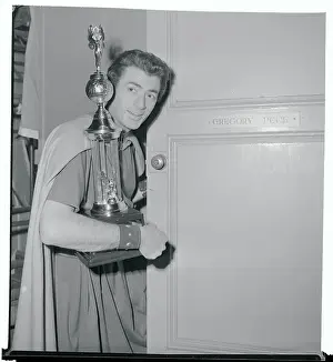 Gregory Peck Holding a Trophy