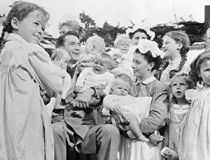 Gregory Peck Kissing Babies