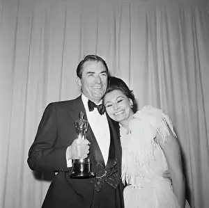 Prints of Gregory Peck holds his Academy Award for Best Actor (for To Kill A Mockingbird), while Sophia Loren puts her head on this shoulder The enduring elegance and charisma of Sophia Loren: Gregory Peck with Sophia Loren and Oscar