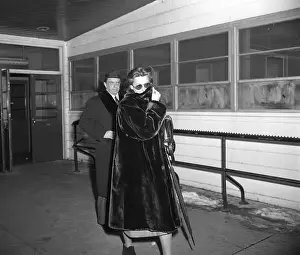 Hiding Prints: Greta Garbo Hiding Face with Coat