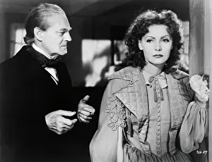 Prints of (Original Caption). Greta Garbo and Lionel Barrymore in Camile Timeless Elegance: The Iconic Greta Garbo Collection: Greta Garbo And Lionel Barrymore