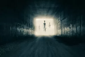 Images Dated 22nd December 2018: A group of aliens emerging from the light at the end of a dark sinister tunnel