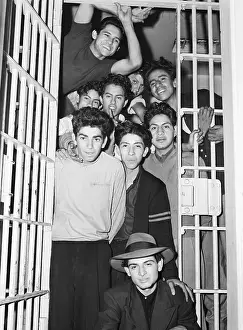 Group of Boys Grin from Jail Cell