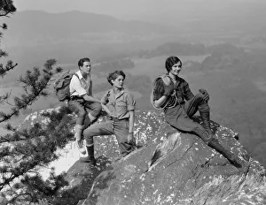 Climbing Collection: Group of three climbers atop mountain