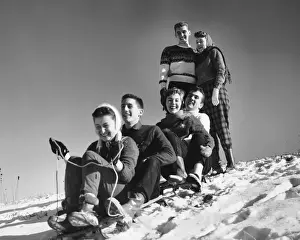 Tobogganing Prints: Group of friends tobogganing