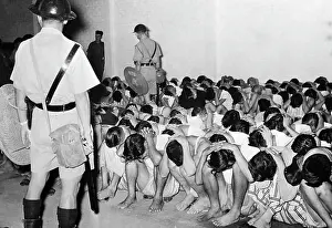 Kowloon Prints: Group Of Guarded Rioters Crouching