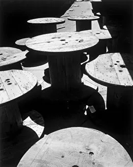 Group of large empty wooden spools