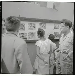 Guatemala Prints: Group Looking at Photos on Wall