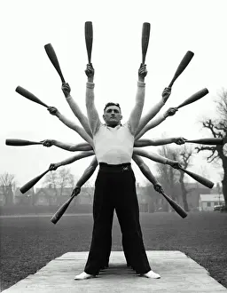 Group of men exercising, making star formation with arms (B&W)