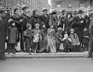 Warm Clothing Prints: Group of people with children (6-7, 8-9) waiting on bus stop in cold weather