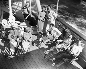 Boat Deck Gallery: Group of people relaxing on cruiser deck (B&W), elevated view