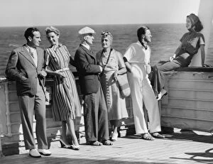 Boat Deck Gallery: Group of people standing on cruiser deck (B&W)