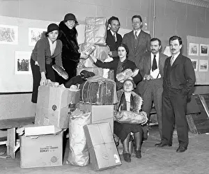 Relief Prints: Group Posing with Boxes and Holding Bread