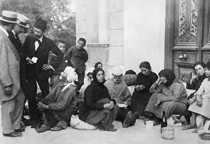 Refugee Prints: Group of Refugees Seated in Doorway
