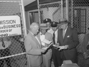Ossining Prints: Guards Looking at Bob Considine's Credentials