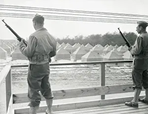 Guards Standing Watch at a Relocation Center