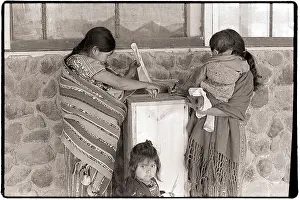 Guatemalan Women with Children Cast Votes