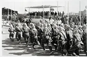 Baghdad Prints: Guerrillas Run Past Review Stand at Parade