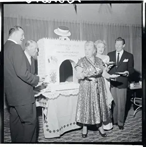 Guests Standing by Cake