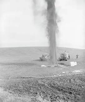 Spraying Prints: Gushing Well On Bare Hill W/Two Trucks