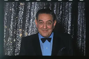 Guy Lombardo Standing in Front of Glittering Curtains