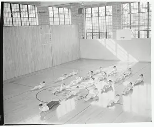 Prints of (Original Caption). New York: Building Better Bodies. Calisthenics and supervised games in a spacious, sunlit gymnasium build bodies that are fitting receptacles for Democratic ideals Hoops Through Time: A Visual Journey of Basketball History: Gym Exercises at Madison Square Garden