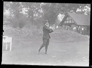 H. J. Topp Playing Golf