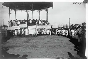 Podium Prints: Haitians with Signs Demonstrate by Podium