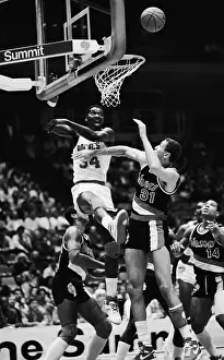 Houston Prints: Hakeem Olajuwon and Sam Bowie Battle for Rebound