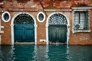 Images Dated 16th November 2013: Half sunken doors of townouse by the canal in Venice, Italy
