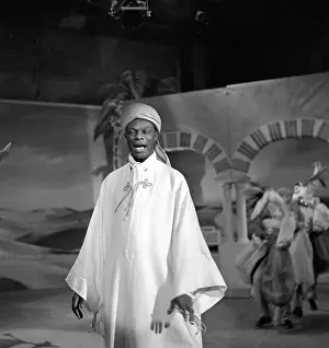 Prints of NEW YORK - OCTOBER 31: Entertainer and pianist Nat King Cole performs on The Ed Sullivan Show on Halloween, October 31, 1954 in New York City, New York A Musical Icon: Halloween Episode Of The Ed Sullivan Show