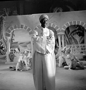 Prints of NEW YORK - OCTOBER 31: Entertainer and pianist Nat King Cole performs on The Ed Sullivan Show on Halloween, October 31, 1954 in New York City, New York A Musical Icon: Halloween Episode Of The Ed Sullivan Show