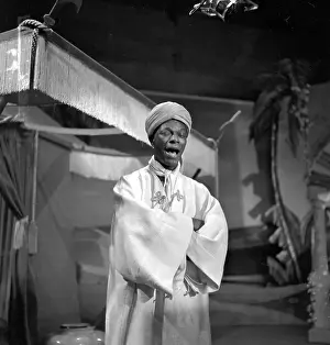 Prints of NEW YORK - OCTOBER 31: Entertainer and pianist Nat King Cole performs on The Ed Sullivan Show on Halloween, October 31, 1954 in New York City, New York A Musical Icon: Halloween Episode Of The Ed Sullivan Show