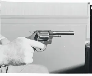 Intimidation Prints: Hand Holding Colt.38 Special Revolver