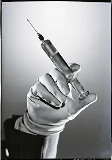Rubber Prints: Hand Holding Hypodermic Needle