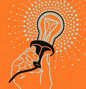 Hand Holding Light Bulb