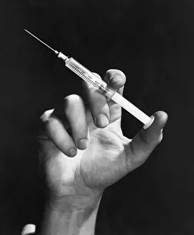 Pointed Prints: Hand Holding Syringe