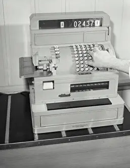 Machine Prints: Hand operating a cash register